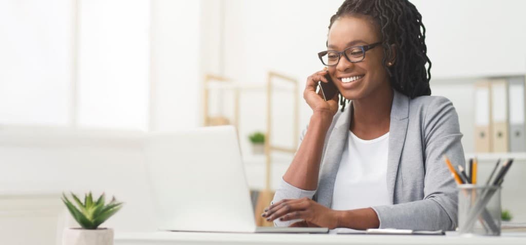 Business owner on a call at her desk